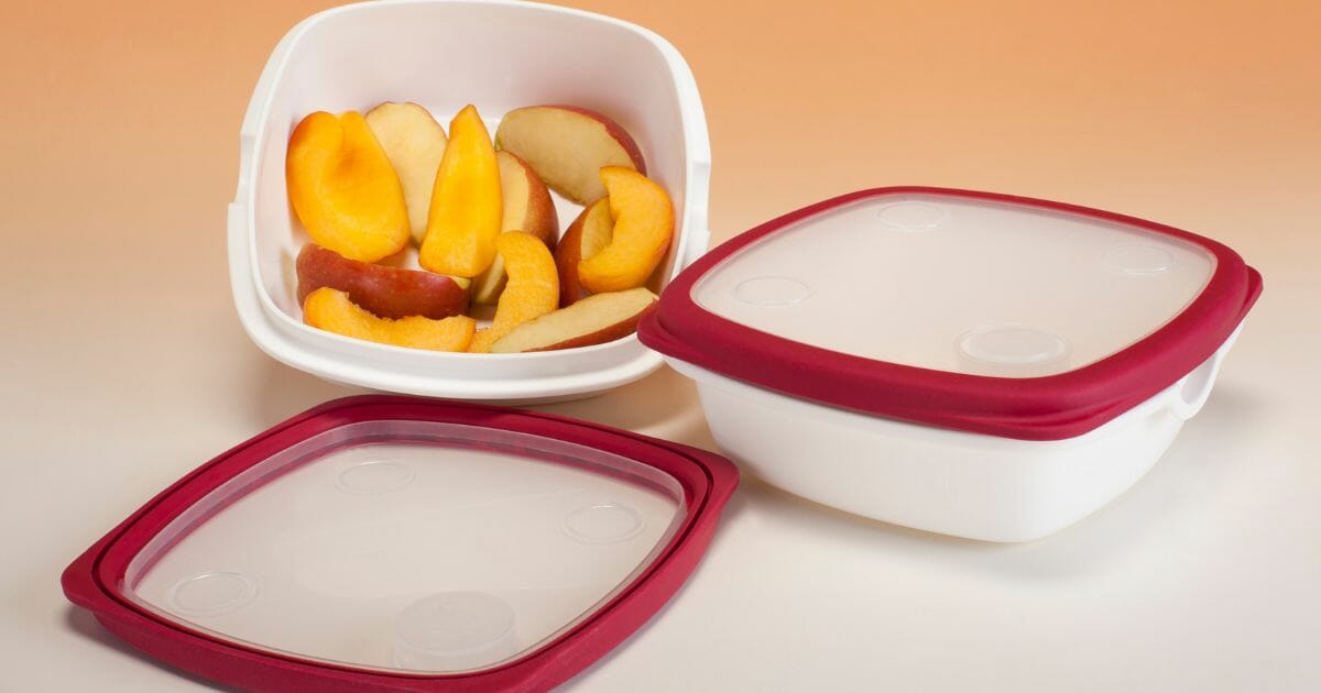 tupperware containing pieces of fruit